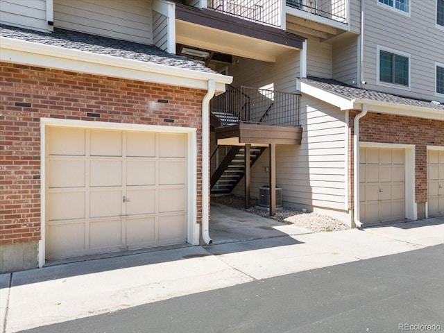 13873 E Lehigh Ave Unit E, Aurora, CO 80014 - garage featuring concrete driveway