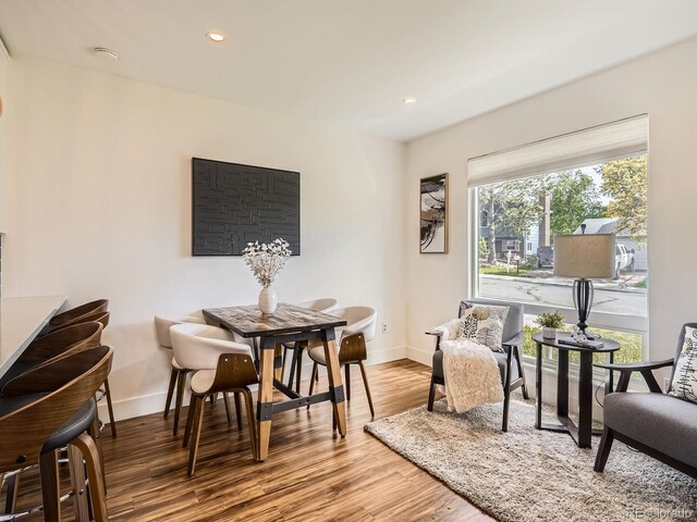 9430 Carr St, Westminster, CO 80021 - dining space featuring baseboards, wood finished floors, and recessed lighting