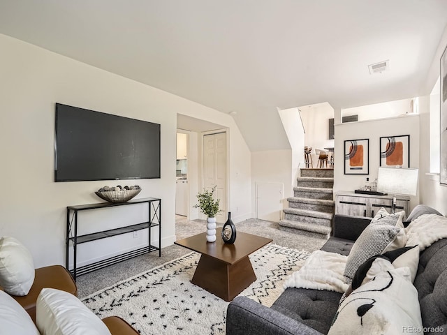 9430 Carr St, Westminster, CO 80021 - living area featuring stairway, light carpet, and lofted ceiling