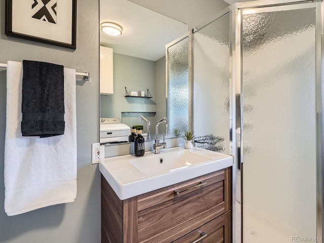 9430 Carr St, Westminster, CO 80021 - full bath with vanity, a shower stall, and washer / dryer