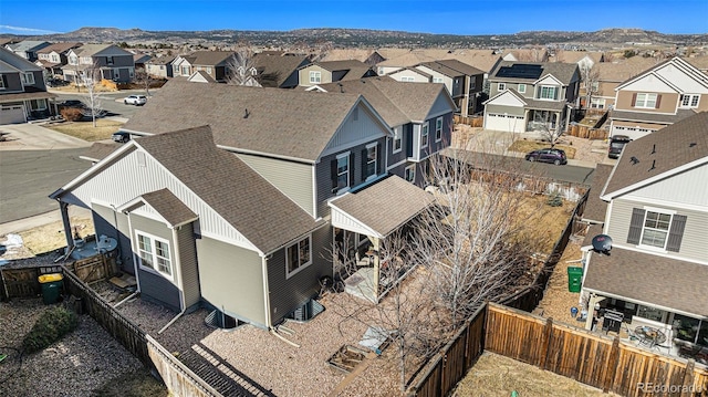 birds eye view of property with a residential view