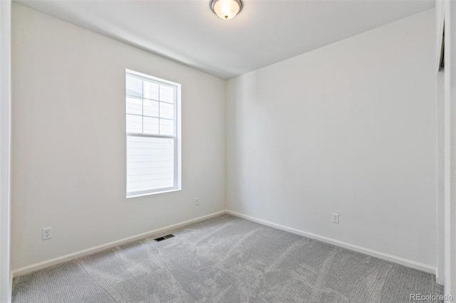 spare room featuring carpet flooring