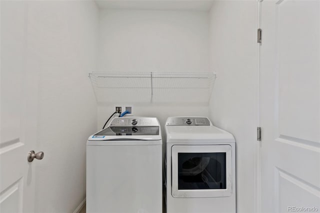 laundry area with washing machine and dryer