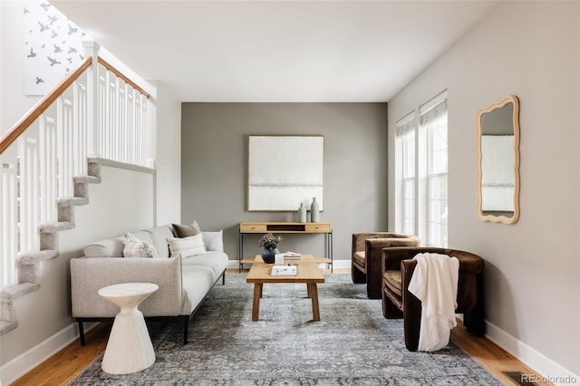 8122 E 6th Pl, Denver, CO 80230 - living room with wood finished floors, baseboards, and stairway