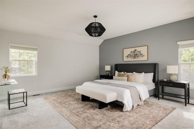 8122 E 6th Pl, Denver, CO 80230 - carpeted bedroom with vaulted ceiling and baseboards