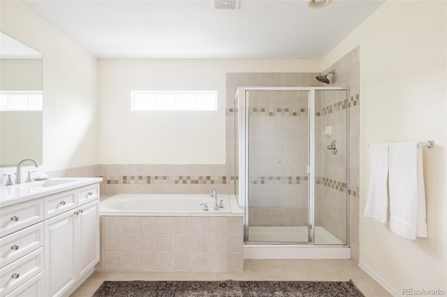 8122 E 6th Pl, Denver, CO 80230 - bathroom with vanity, tile patterned floors, a shower stall, and a bath