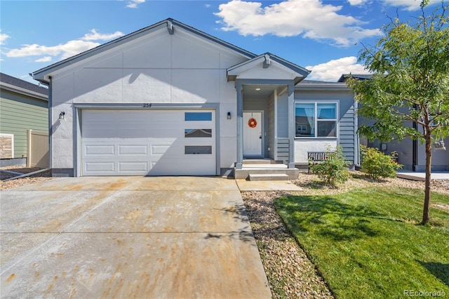 ranch-style house with a garage and a front lawn