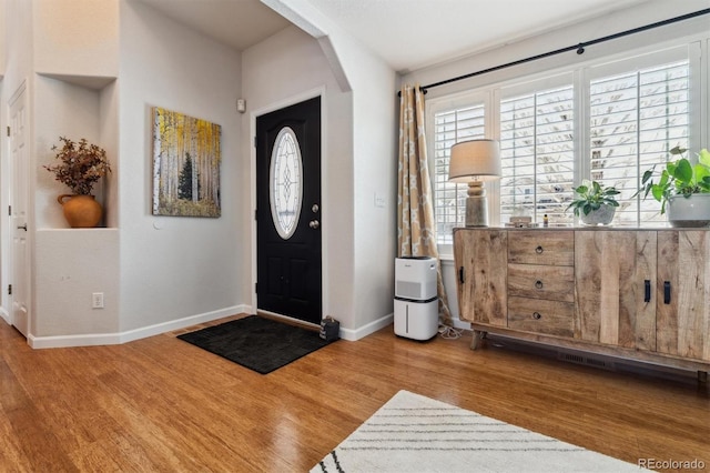 foyer entrance featuring hardwood / wood-style flooring