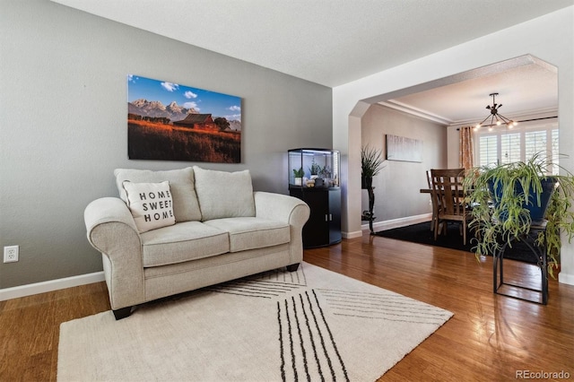 living room featuring hardwood / wood-style floors and a chandelier