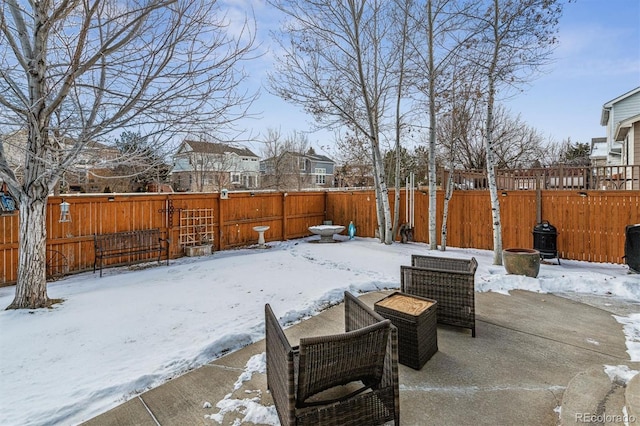 view of snow covered patio