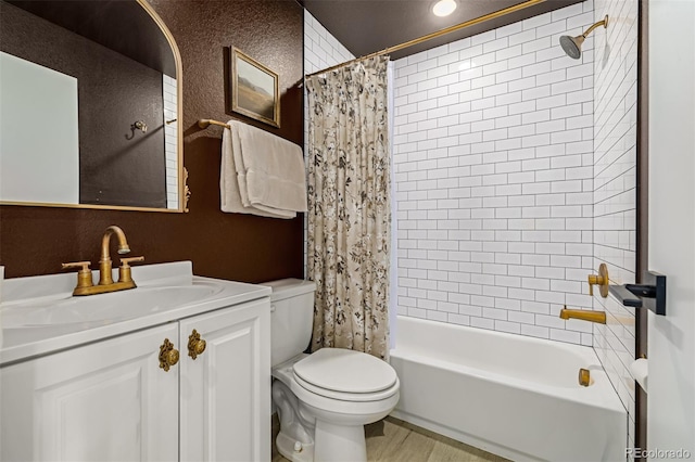 bathroom with toilet, vanity, and shower / bath combination with curtain