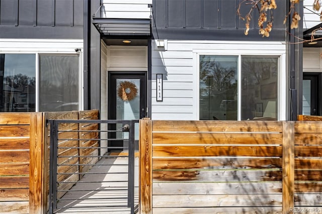 doorway to property with board and batten siding