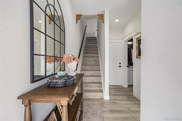 interior space with stairs, recessed lighting, and light wood-type flooring