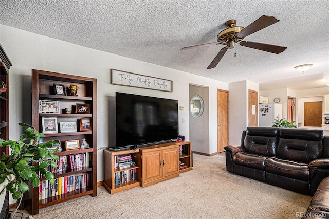 34181 Columbine Trl, Elizabeth, CO 80107 - living area featuring a ceiling fan, light carpet, and a textured ceiling