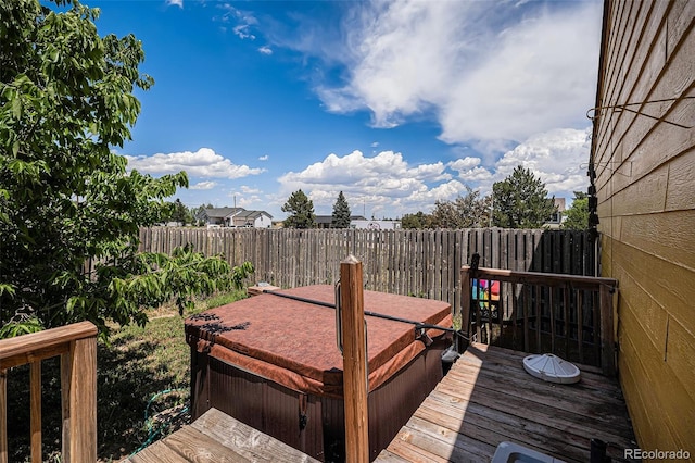 34181 Columbine Trl, Elizabeth, CO 80107 - wooden deck with a covered hot tub and a fenced backyard