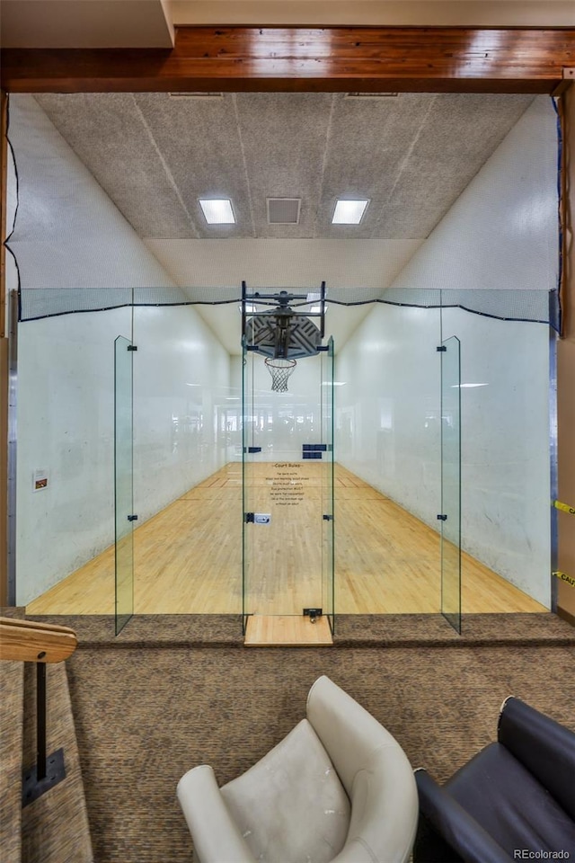 interior space with a sport court and visible vents