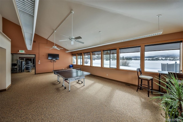 rec room featuring baseboards, carpet floors, and high vaulted ceiling