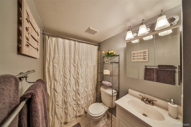 full bathroom with tile patterned flooring, visible vents, toilet, vanity, and a textured ceiling