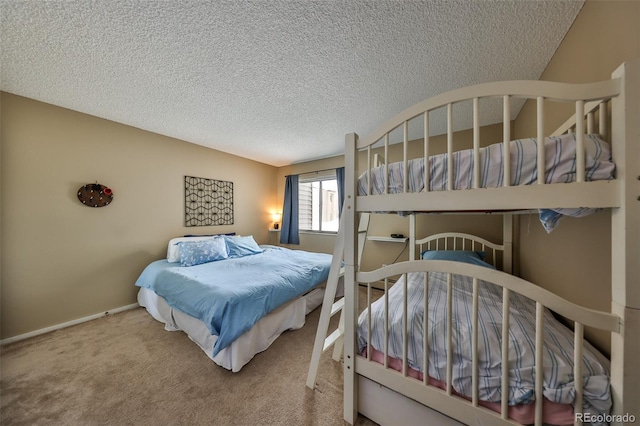 bedroom featuring carpet floors and a textured ceiling