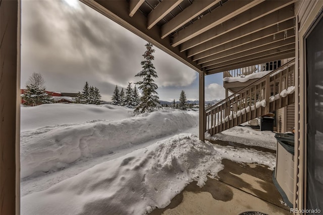 view of snow covered patio