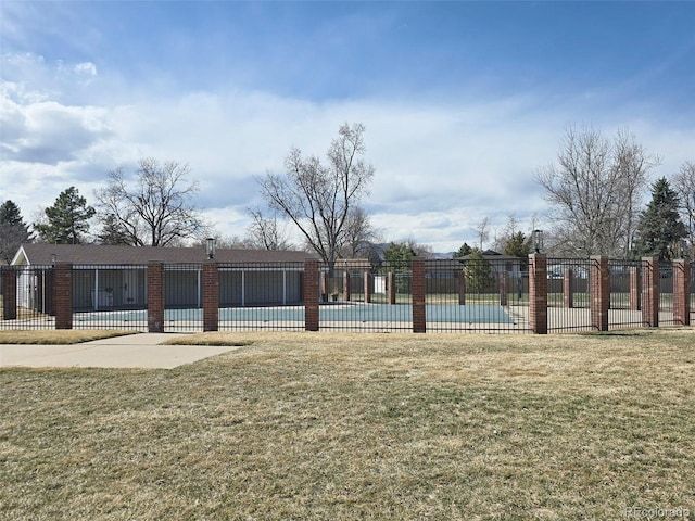 view of community with a pool, a patio area, a yard, and fence