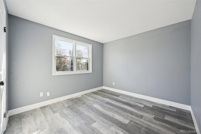 empty room featuring hardwood / wood-style floors