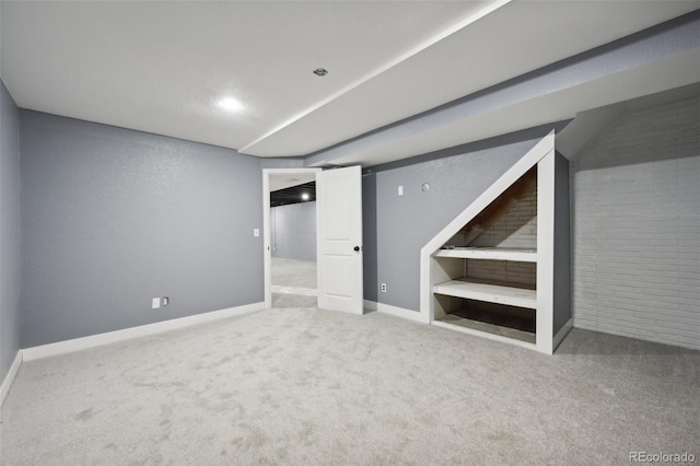 basement featuring carpet flooring