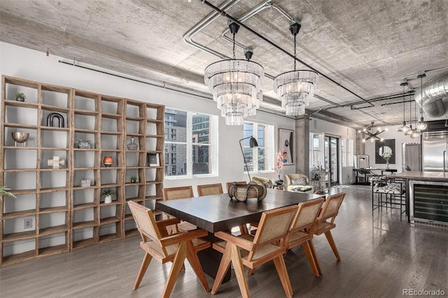1735 19th St Unit 6D, Denver, CO 80202 - dining space with a chandelier, wine cooler, and wood finished floors