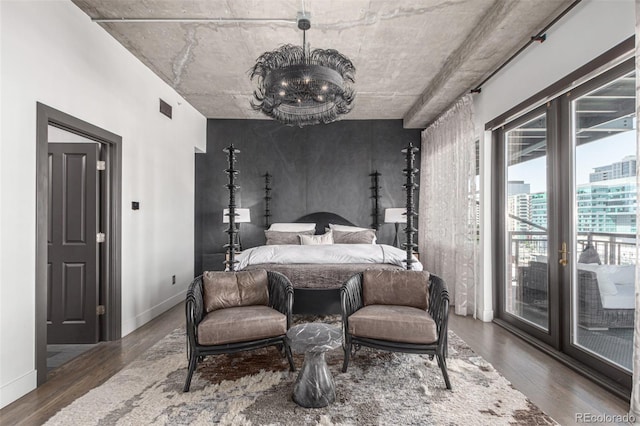 1735 19th St Unit 6D, Denver, CO 80202 - bedroom featuring access to outside, wood finished floors, and baseboards