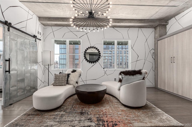 1735 19th St Unit 6D, Denver, CO 80202 - sitting room featuring a barn door, wood finished floors, healthy amount of natural light, and a chandelier