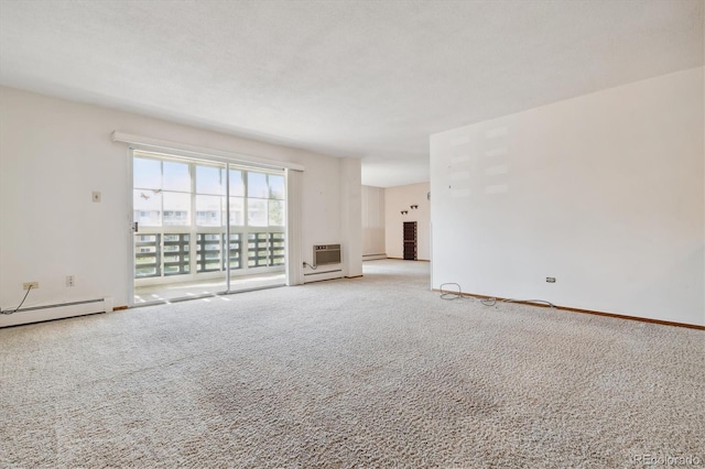 interior space featuring a baseboard heating unit, a textured ceiling, and an AC wall unit