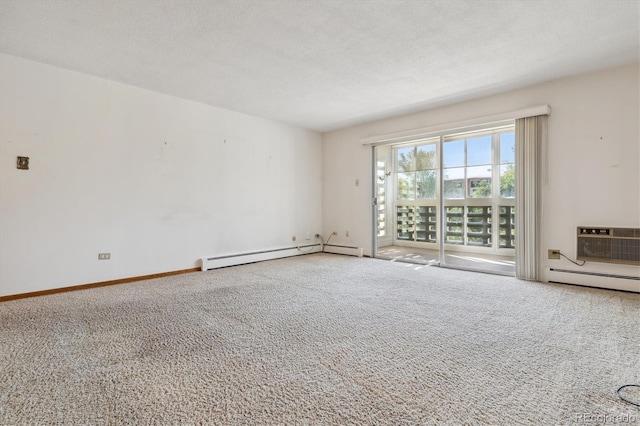 empty room featuring carpet flooring, baseboard heating, a wall mounted air conditioner, and a textured ceiling