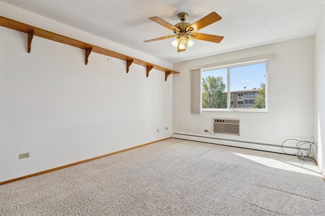 carpeted spare room with ceiling fan, a wall unit AC, baseboard heating, and a textured ceiling