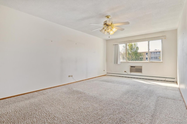 carpeted spare room featuring a wall mounted AC, a textured ceiling, a baseboard radiator, and ceiling fan