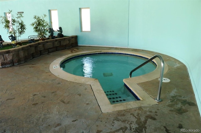 view of swimming pool featuring an indoor in ground hot tub