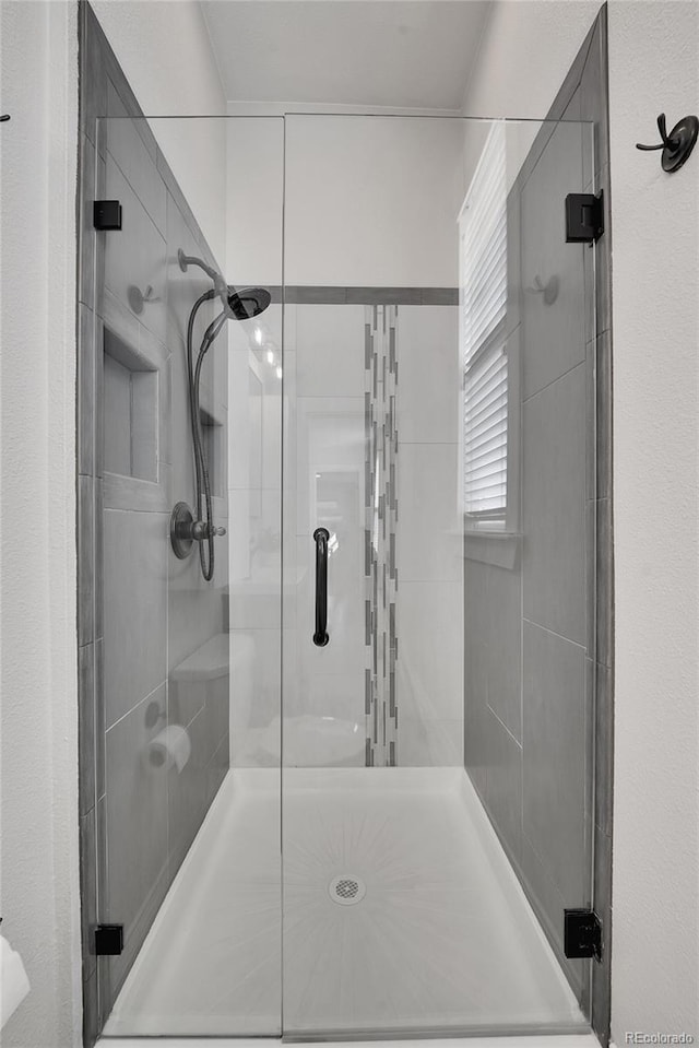 full bathroom featuring a shower stall