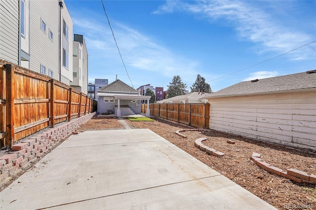 view of yard with a patio area and a fenced backyard