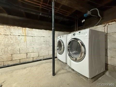 washroom featuring washer and dryer and laundry area