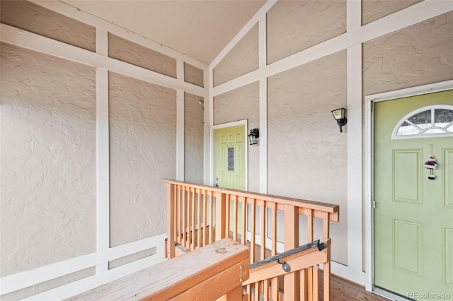 view of exterior entry featuring stucco siding and covered porch