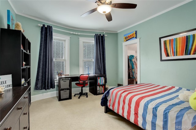 bedroom featuring baseboards, ornamental molding, a ceiling fan, and light colored carpet