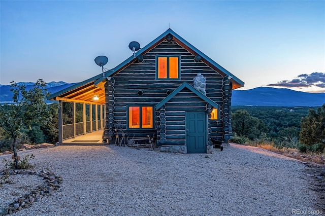 view of front of property with a mountain view