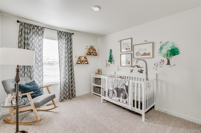 carpeted bedroom featuring a crib