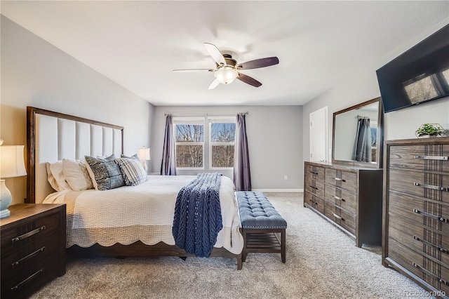 bedroom with carpet floors, a ceiling fan, and baseboards
