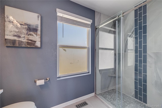 full bathroom with tile patterned flooring, a shower stall, visible vents, and toilet