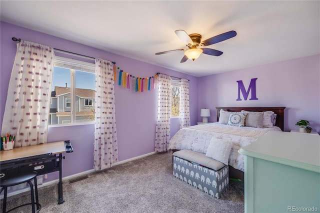 bedroom featuring carpet floors, visible vents, ceiling fan, and multiple windows