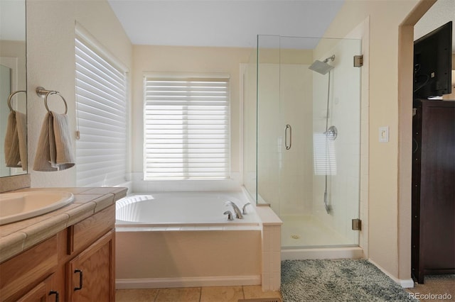 1386 Avgare Way, Erie, CO 80516 - bathroom with vanity, a stall shower, a garden tub, and tile patterned flooring