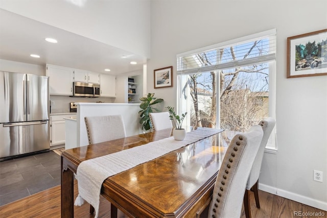 dining space featuring recessed lighting, baseboards, and dark wood-style flooring