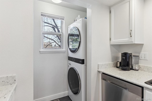 laundry room featuring laundry area and stacked washing maching and dryer