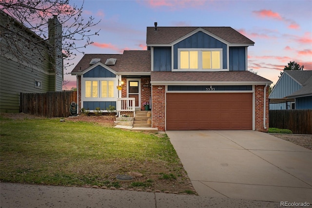 3593 S Gibralter Cir, Aurora, CO 80013 - tri-level home featuring an attached garage, roof with shingles, brick siding, and driveway