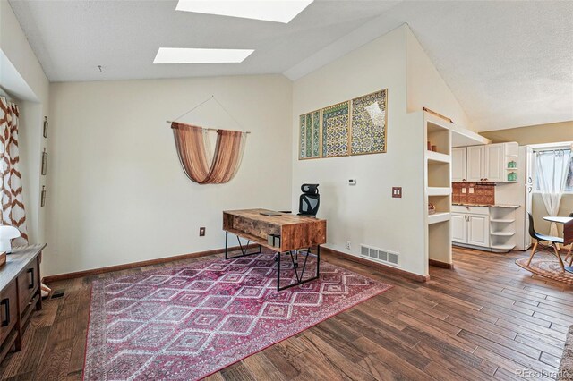 3593 S Gibralter Cir, Aurora, CO 80013 - office space featuring a skylight, dark wood-style floors, baseboards, and high vaulted ceiling